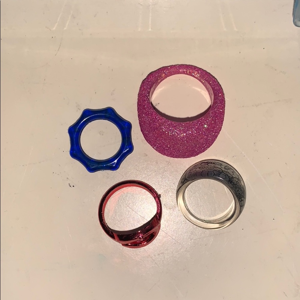4 rings a red, blue, pink, and gray
